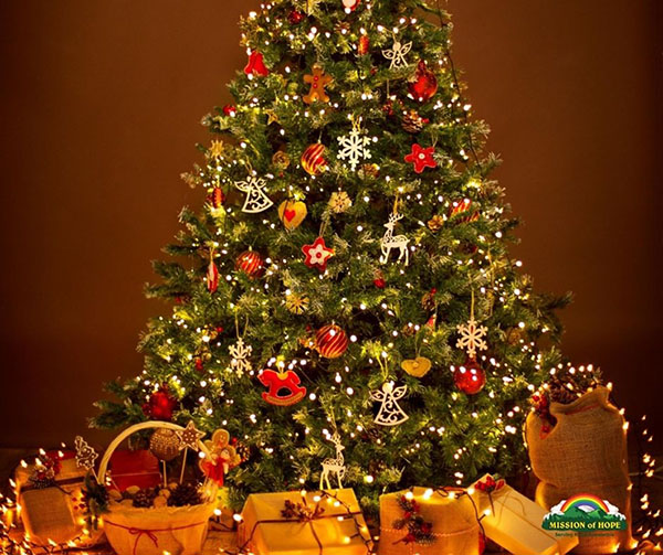 A christmas tree with gifts and decorations on a brown background.