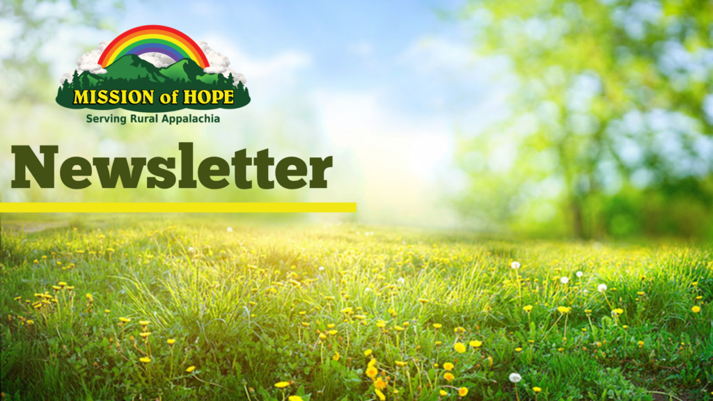 Newsletter header with the text "mission of hope, serving rural appalachia" over a sunny meadow with dandelions and trees, featuring a rainbow graphic.